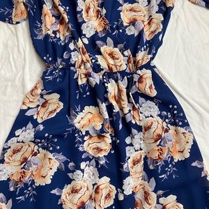 Beautiful flower dress.  Like new it’s a short length, medium size